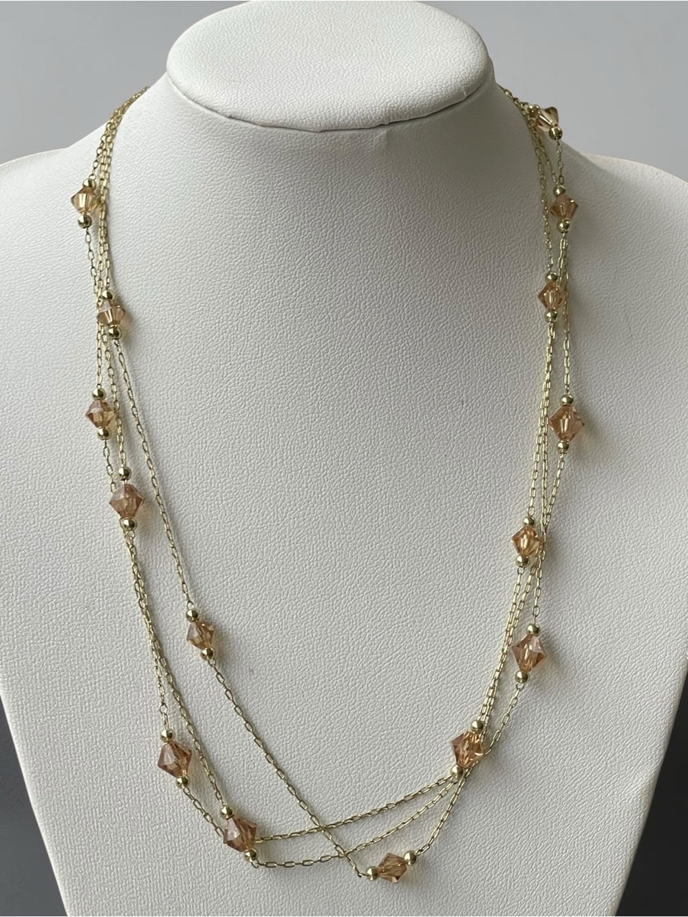 2028 Gold Tone Champagne Crystal Triple Strand Station Necklace